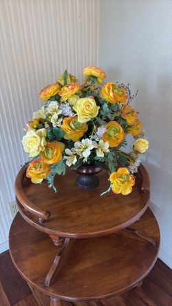 Pot With Fake Yellow Flowers. 