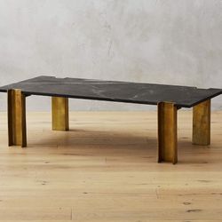 Cb2 Alcide Rectangulaire Marble Coffee Table Polished black marble w gold legs. Very Heavy