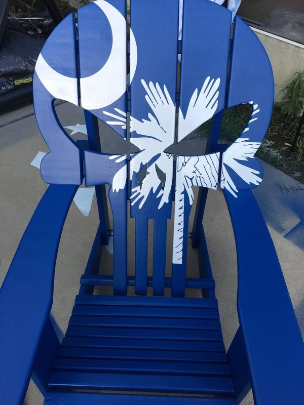 Painted and customized " punisher " skull Adirondack chair.