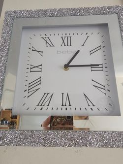 A DESIGNED WALL CLOCK MADE BE BEBE