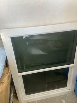 44 1/2 x 34 3/4 xo window with grey tint and Silicon