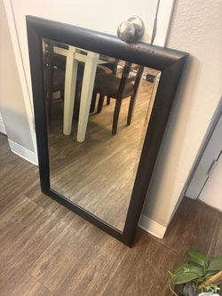 Mirror with black wood frame