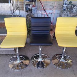 Adjustable Swivel Vinyl Bar Stools w/Chrome Base.