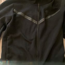 Black Nike Tech hoodie. 