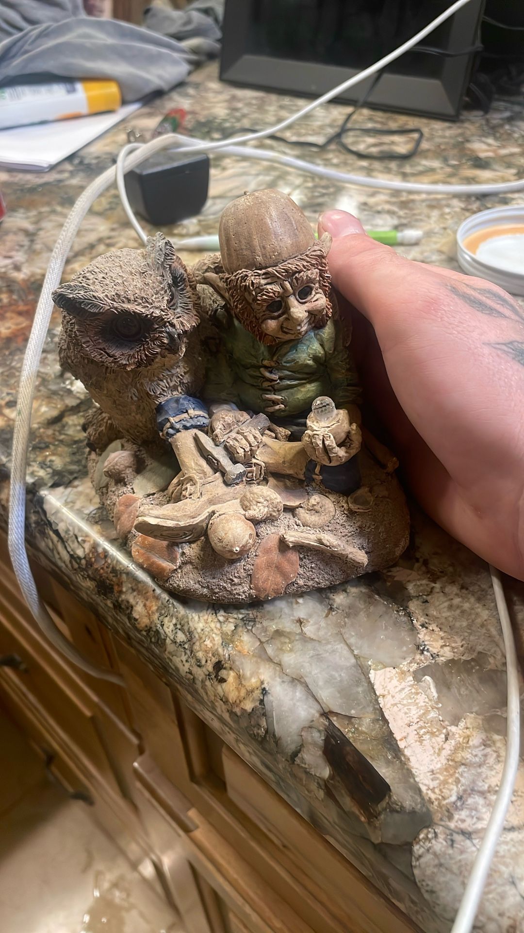 A gnome and owl statue