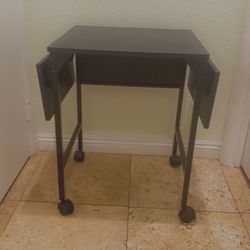 (2) Black Rolling tables/desk with extensions