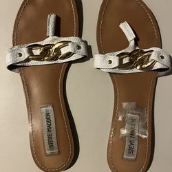 Flat, Steve Madden’s gold chain accent over leather thong sandals
