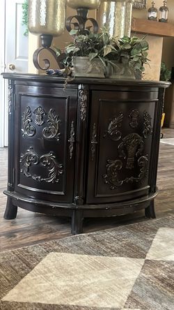 Antique half moon dark wood cabinet