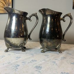 Pair of Vintage Silver‑Plated Pitchers — Ornate Claw Feet — Natural Patina — Classic Baroque Style