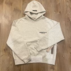Light oatmeal fear of god essentials hoodie