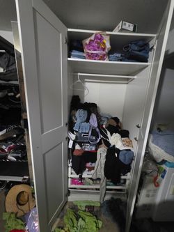 Tall closet with large mirror