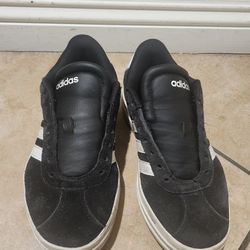 Adidas tennis shoes. Needs shoes laces. Size 5
