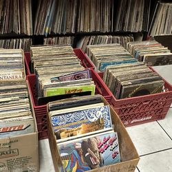 Saturday April 18 Record sidewalk sale $1.00 records vhs  CDs and cassettes