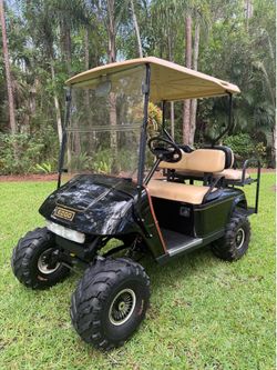 SUPER CLEAN CUSTOM EZGO GOLF CART!  LIFTED 4 SEATER RUNS AND DRIVES GREAT!!