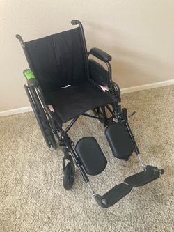 Wheelchair New with Elevating Leg and Footrests