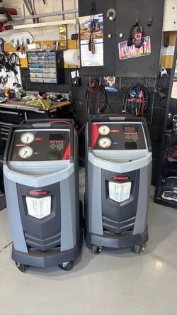 AC automotive evac and recharge with profesional robin air machines.