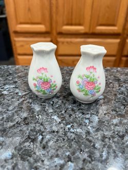 Vintage Porcelain Floral Pair of Salt and Pepper Shakers Hand Painted.  Size approximately 2 1/2 inches tall.  Preowned never used.