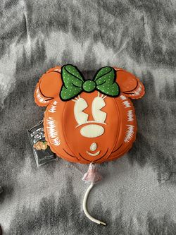 Glow in the dark Minnie crossbody purse.