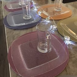 NEW, CLEAR  PLASTIC SET ,12 PLATES, 12 MUGS, 12 Placemats.USE INDOOR OR BY POOL/PATIO. PAID OVER $100.  BUY TODAY.  $35.
