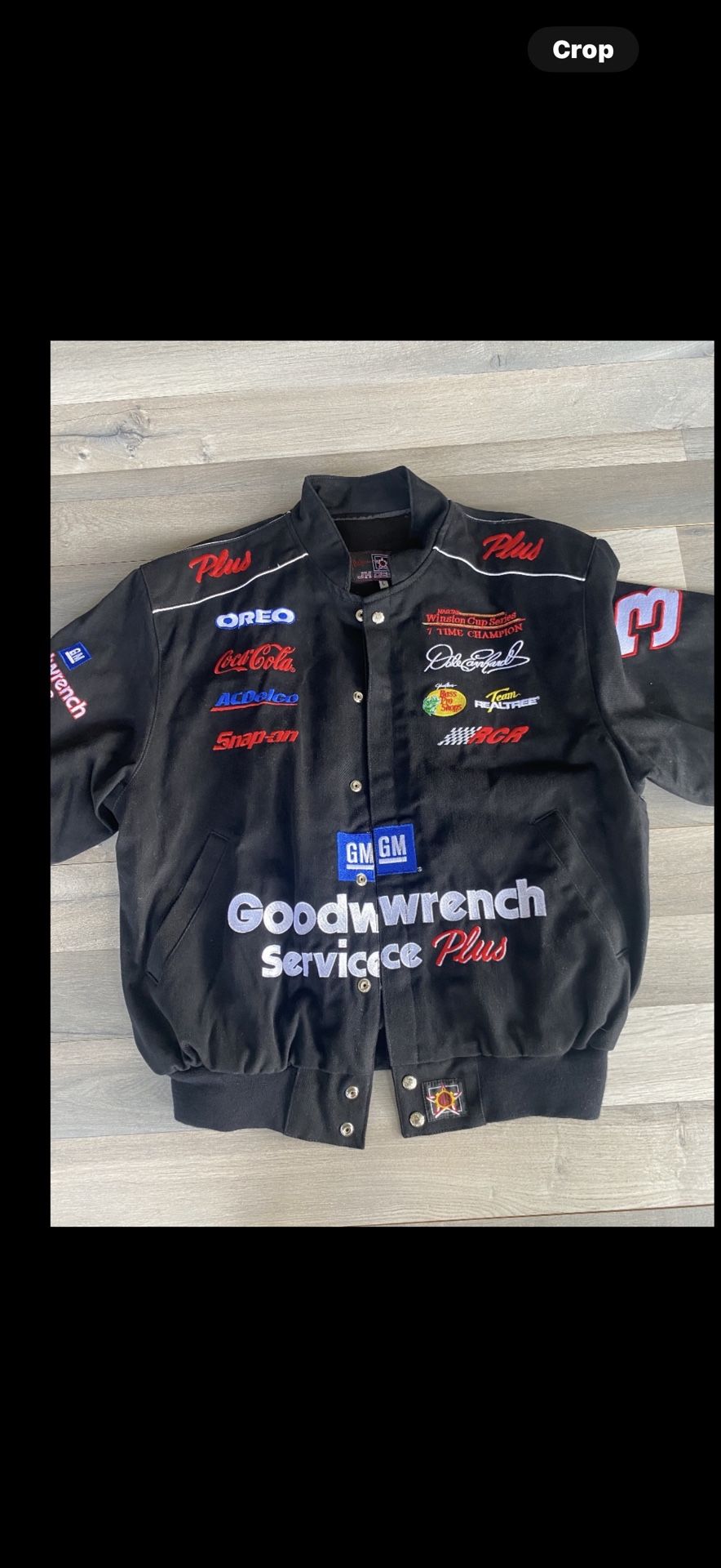 The product is a NASCAR Dale Earnhardt Goodwrench jacket in size Large. This jacket showcases support for the iconic driver, Dale Earnhardt, and is de