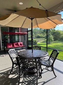 48” Cast Aluminum Outdoor Table and 4 Chairs with Tan Umbrella and Base, Bronze Color