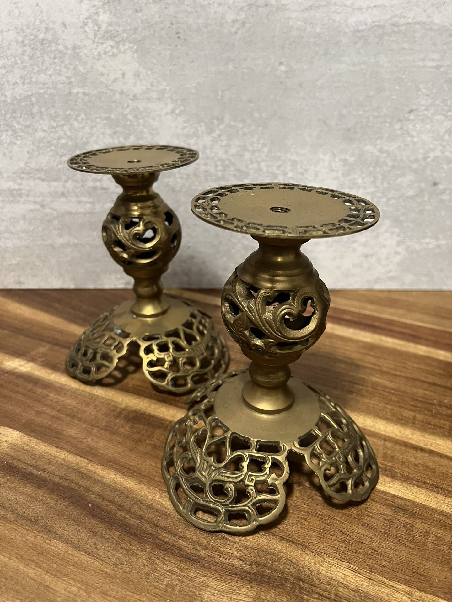 pair of ornate, vintage-style brass candle holders