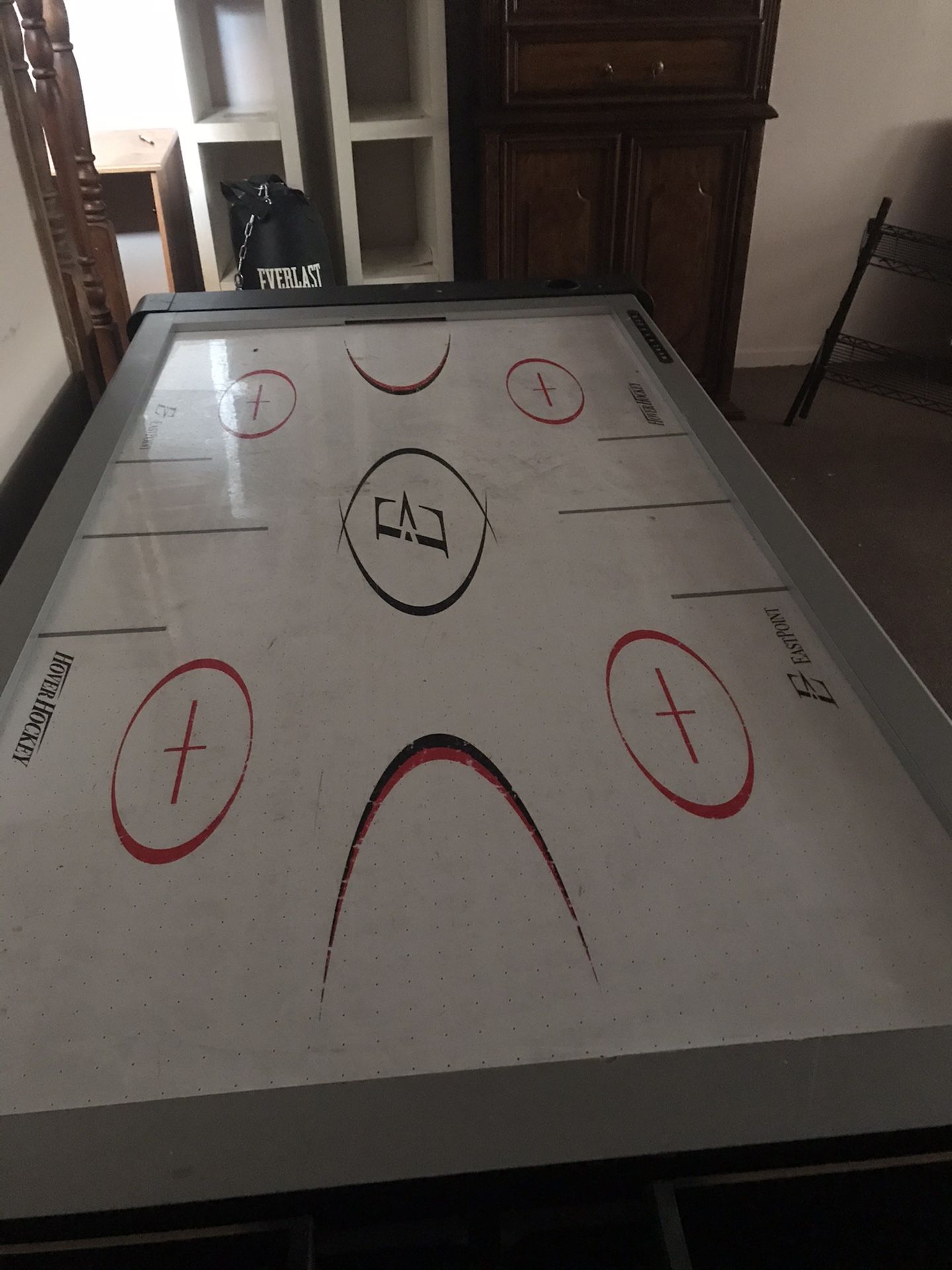 Air hockey , pool table with pool sticks and balls