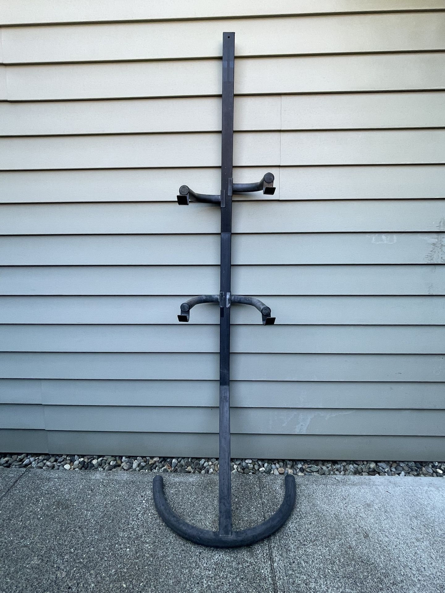 Heavy-Duty Black 2-Bicycle Storage Stand, Space-Saving Design for Mountain & Road Bikes.