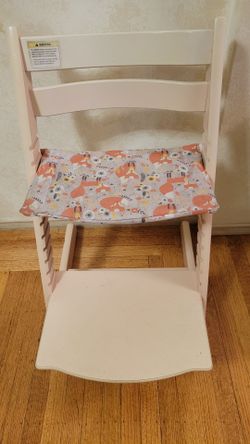 Pink Stokke Tripp Trapp kid's dining chair with a custom seat cushion