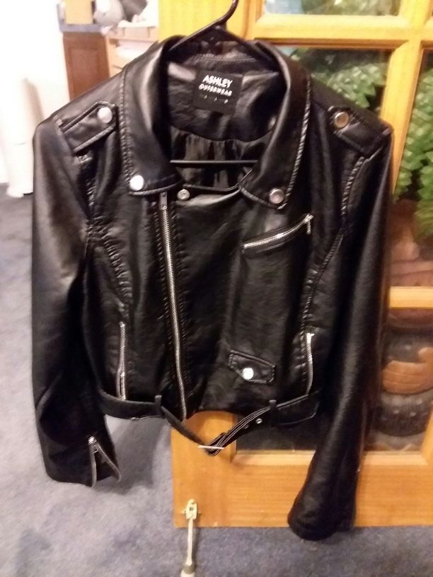 Really nice leather looking jacket large in size material contents on pictures
