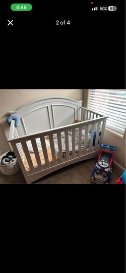 Grey wooden convertible crib