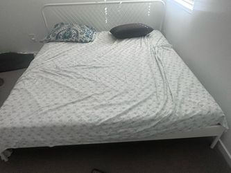 King size bed frame and mattress along with bed