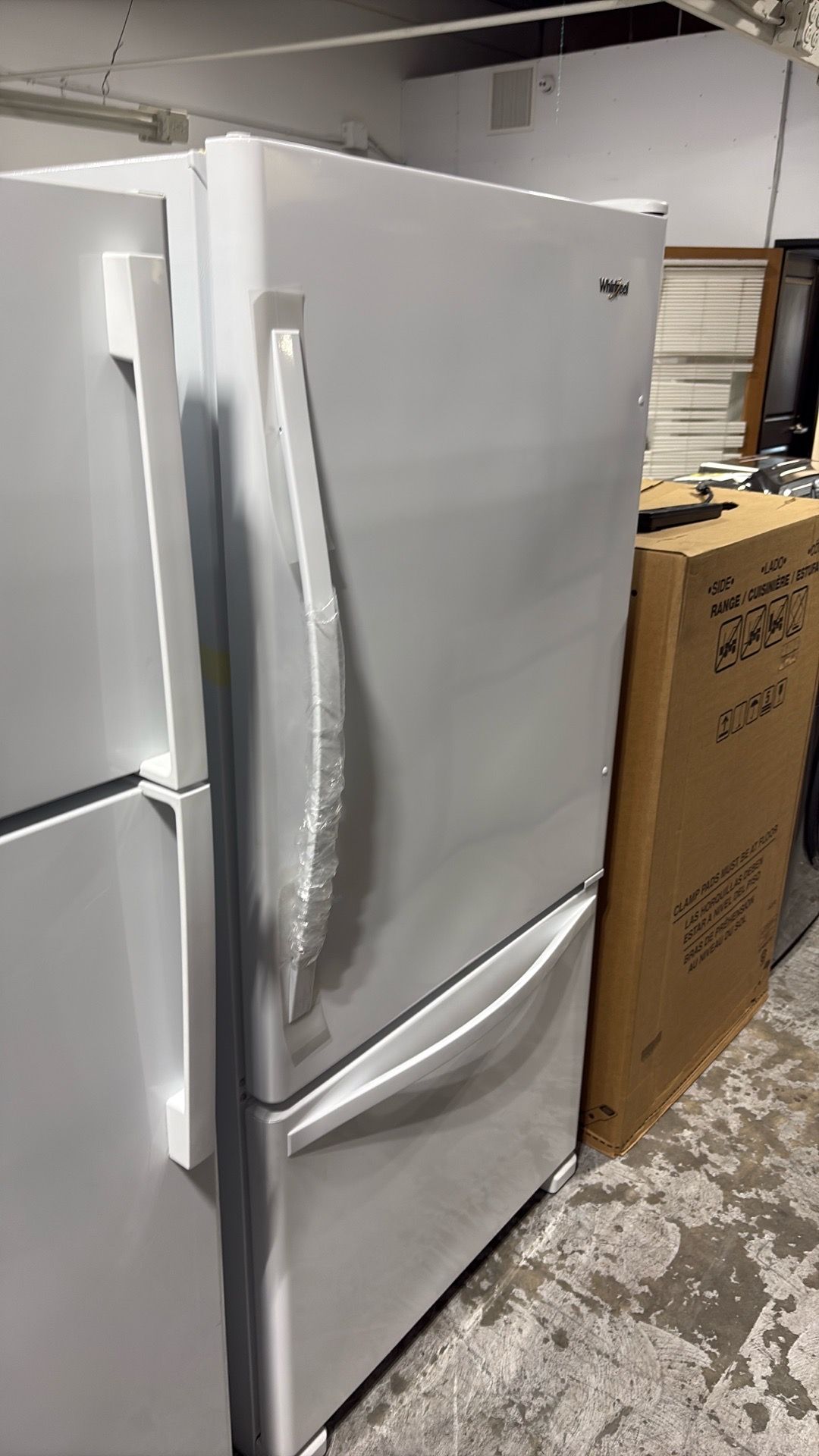 Whirlpool 33 inch wide refrigerator with reversible door