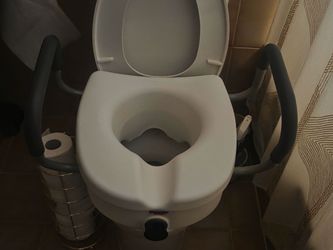 Toilet Assistance with handles to raise seat higher
