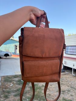 A brown mink backpack