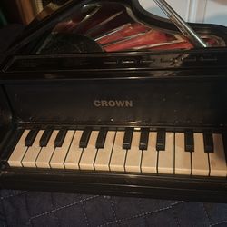 vintage Crow piano, a small musical instrument