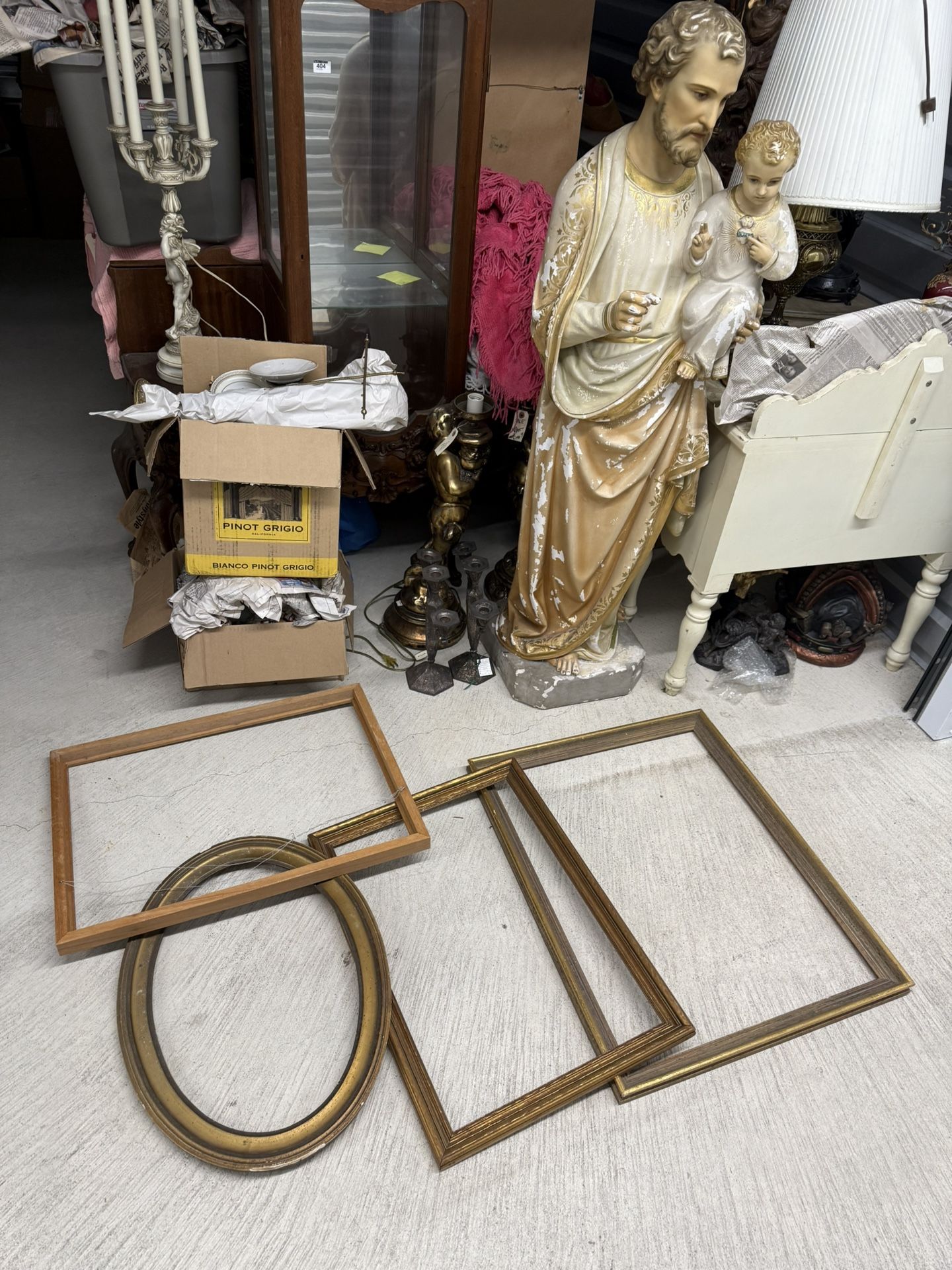 A collection of antique wooden and gilded picture frames.