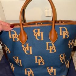Authentic Dooney Bourke Large Leather Navy Blue Monogram Tote Bag. In really prestige condition like new. $120
