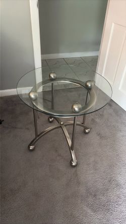 Set of two matching glass coffee tables.
