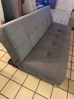 Gray tufted sofa bed