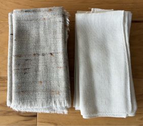 8 cloth dinner napkins, 4 multi color beige and 4 white.