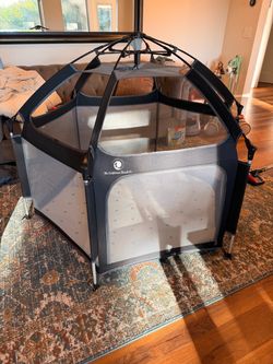 The California Beach Co Pop ‘N Play Playpen with Mattress and Cover