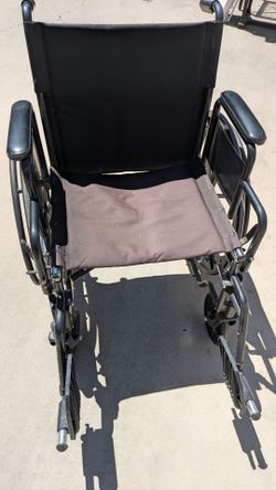 Located in Albuquerque NM. Wheelchair with footrests.