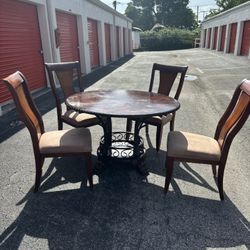 Round Wood/Metal dining table and 4 Wood chairs 