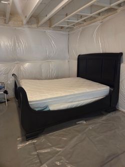 Elegant queen black sleigh bed frame with mattress included   for sale