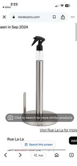 Paper holder with spray bottle