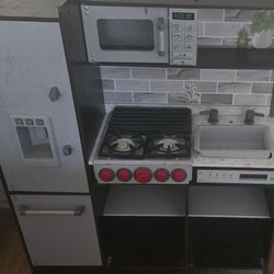 KidKraft Uptown Elite Espresso Play Kitchen Lights and Sounds, Working Ice Maker and Click and Turn Knob