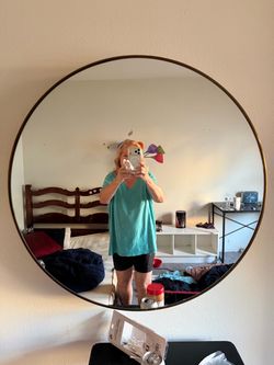 MIRROR, gold 31" diameter; cross streets are Arapaho & Waterview