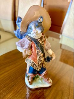 Lladro "Puss In Boots" Francisco Polope 8.75"x 4.75" Blue, purple & red. https://offerup.com/redirect/?o=bWludC5hcw== is pick up deliver  2011