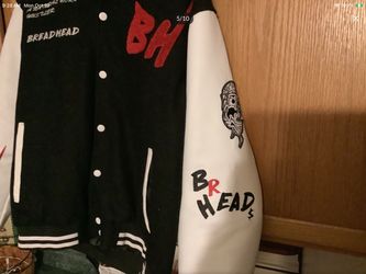 Bread Bully letterman varsity jacket features a black wool body with contrasting white leather sleeves and red embroidered text.  Beautifully done sti